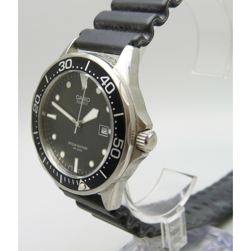 7144 - A Casio WR200M wristwatch with black dial and date aperture, 44mm including crown