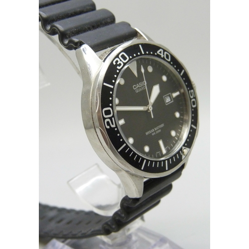 7144 - A Casio WR200M wristwatch with black dial and date aperture, 44mm including crown