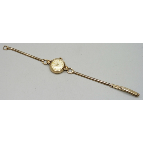 7148 - A lady's 9ct gold Omega wristwatch on a 9ct gold strap, 14.8g, 20mm including crown