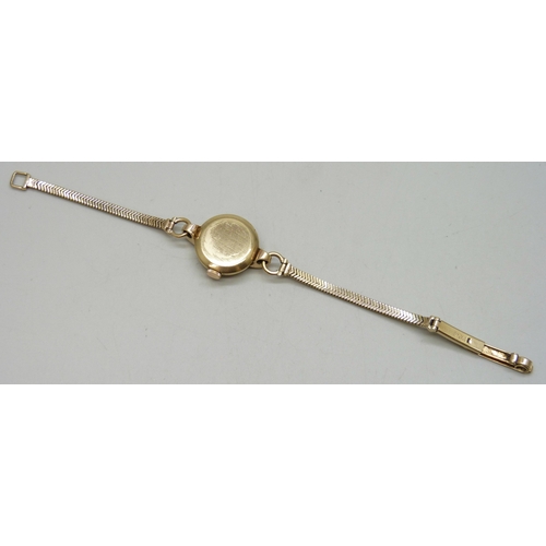 7148 - A lady's 9ct gold Omega wristwatch on a 9ct gold strap, 14.8g, 20mm including crown