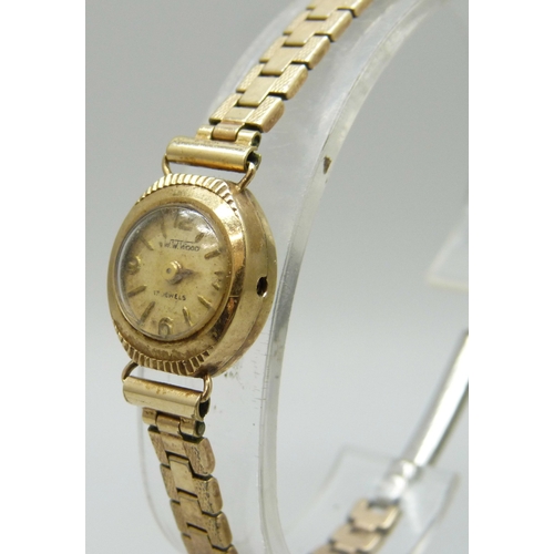 7150 - A 9ct gold cased lady's wristwatch on a plated strap, a/f, 1.3g case back