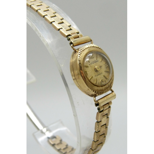 7150 - A 9ct gold cased lady's wristwatch on a plated strap, a/f, 1.3g case back