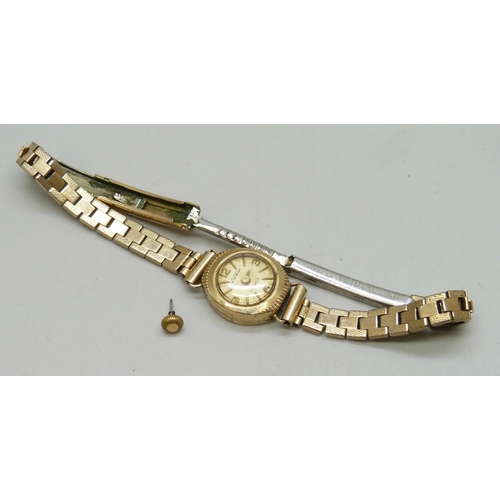 7150 - A 9ct gold cased lady's wristwatch on a plated strap, a/f, 1.3g case back