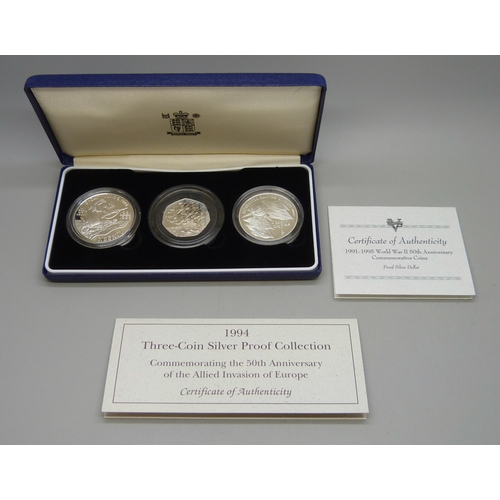 7183 - The Royal Mint, a 1994 silver proof three coin collection, silver dollar (26.73g 90%), 1 franc (22.2... 