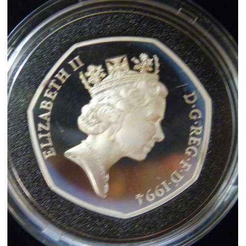 7183 - The Royal Mint, a 1994 silver proof three coin collection, silver dollar (26.73g 90%), 1 franc (22.2... 