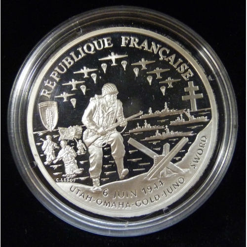 7183 - The Royal Mint, a 1994 silver proof three coin collection, silver dollar (26.73g 90%), 1 franc (22.2... 
