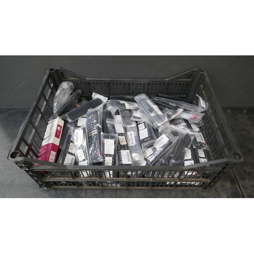 5049 - Approximately 80 Universal TV remotes and a black plastic storage crate