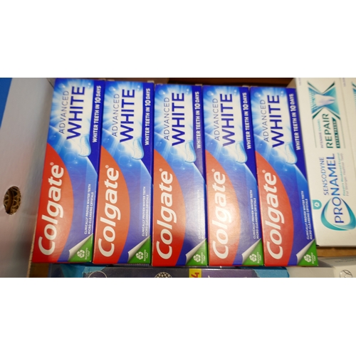 6051 - A box of toothcare items to include Colgate, Pronamel, Oral B, etc. (516662474-3) *This lot is subje... 
