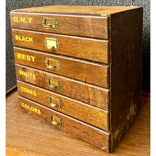An early 20th Century oak table top chest of drawers, bearing Dewhursts ...