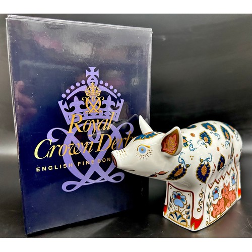 A Royal Crown Derby Priscilla Pig paperweight, an exclusive for