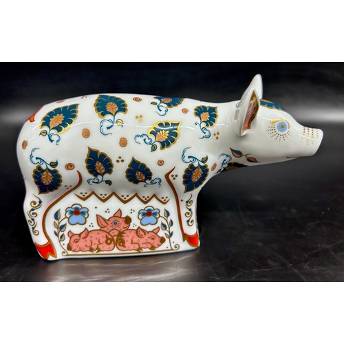 A Royal Crown Derby Priscilla Pig paperweight, an exclusive for