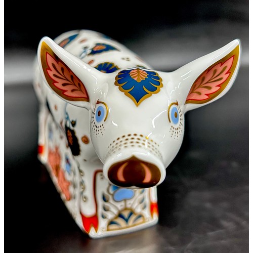 A Royal Crown Derby Priscilla Pig paperweight, an exclusive for