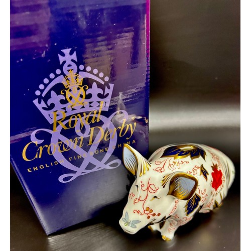 A Royal Crown Derby Pig Money Box paperweight, gold stopper, boxed