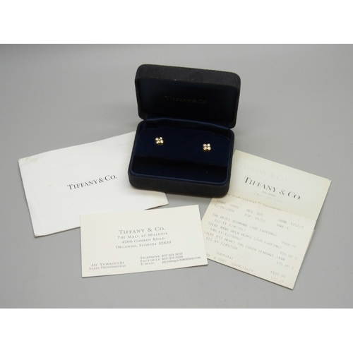 7008 - A pair of Tiffany & Co. New York 18ct gold and diamond stud earrings, 2g, approximately 7mm, boxed a... 