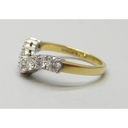 7284 - An 18ct gold seven stone diamond chevron/wishbone ring, total diamond weight 1.00 carat (stamp insid... 