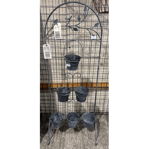 3008 - A free standing metal six pot garden planter