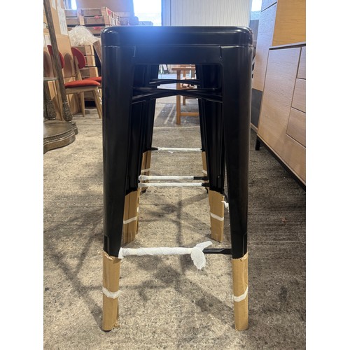 3043 - A pair of black metal Tolix style barstools