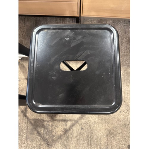 3044 - A pair of black metal Tolix style barstools