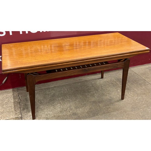 59 - A Danish teak metamorphic elevator coffee/dining table