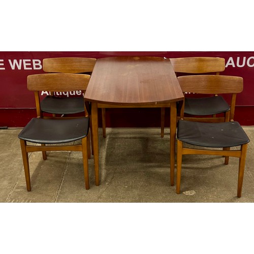 64 - A teak drop-leaf table and four chairs