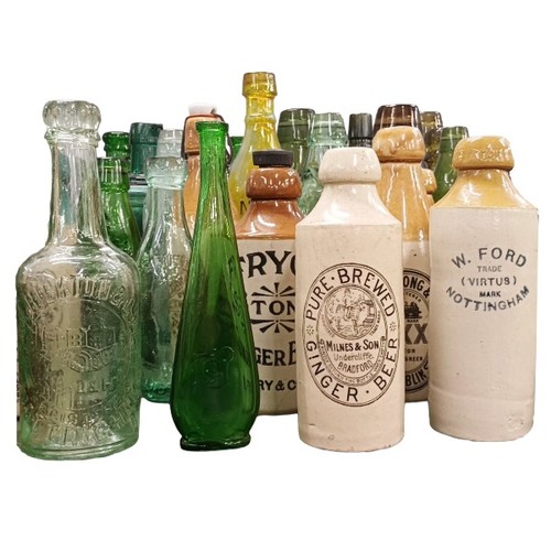 2152 - A large collection of vintage glass and stoneware bottles, approximately 60, including Hendry's Edin...