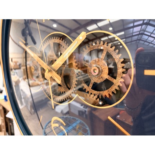 3007A - A navy blue and gold effect moving gear clock