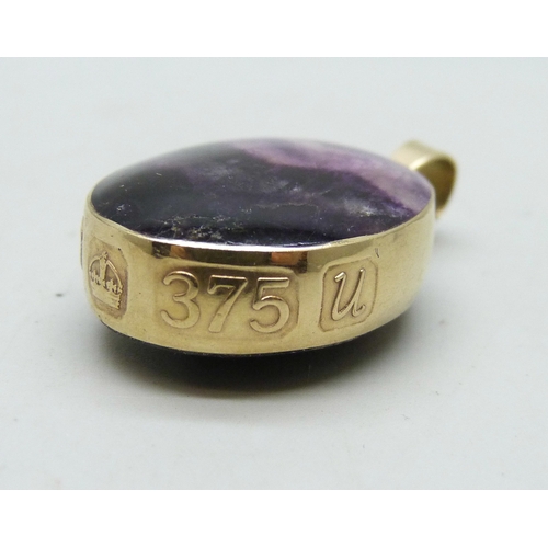 7001 - A 9ct gold mounted Blue John double sided pendant, 8.2g, 3.1cm including bail