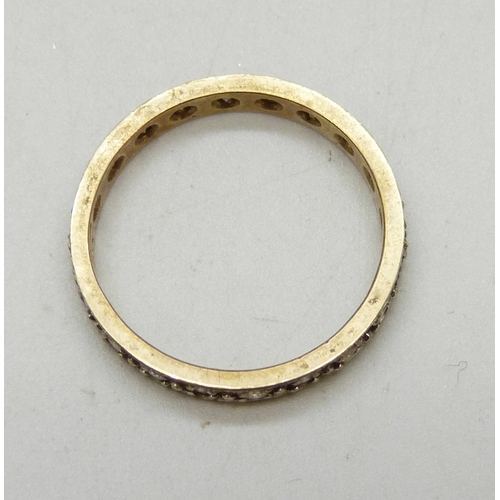 7012 - A 9ct gold and diamond eternity ring, 2.9g, S
