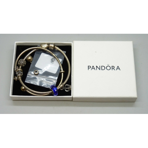 7014 - A collection of silver mainly Pandora jewellery, torque bangle a/f, 45g total
