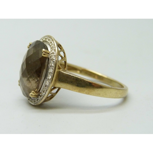 7015 - A 9ct gold, smoky quartz and diamond ring, 4.4g, W