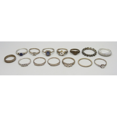 7021 - A collection of silver and white metal rings, one Pandora, and one yellow metal and silver, 35g tota... 