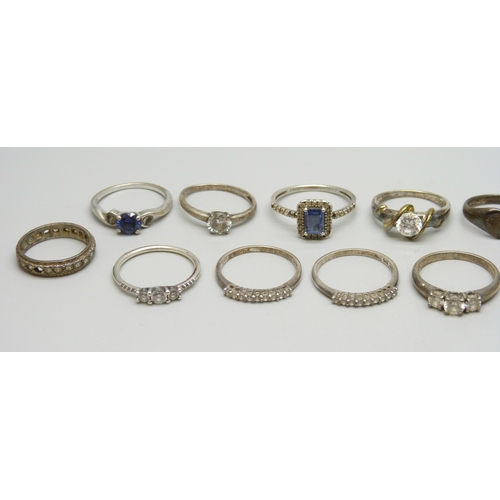 7021 - A collection of silver and white metal rings, one Pandora, and one yellow metal and silver, 35g tota... 