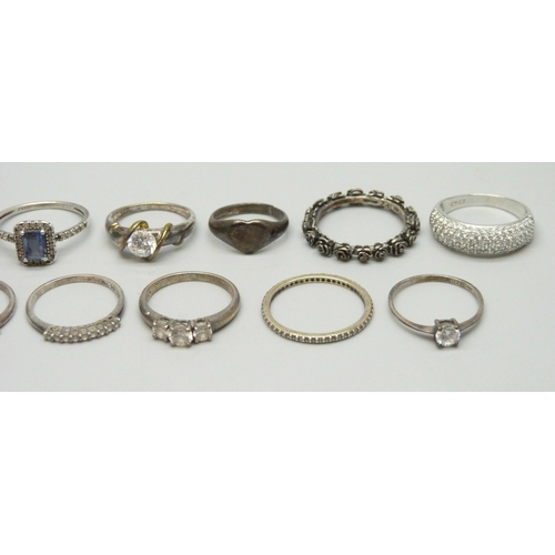 7021 - A collection of silver and white metal rings, one Pandora, and one yellow metal and silver, 35g tota... 