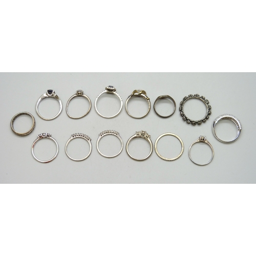 7021 - A collection of silver and white metal rings, one Pandora, and one yellow metal and silver, 35g tota... 