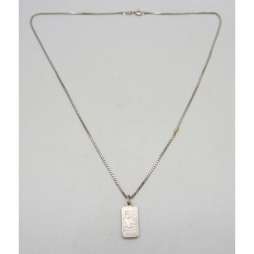 7029 - A silver ingot pendant with Aquarius design, marked West Germany 3g 999.8 fine silver, 2.2cm includi... 