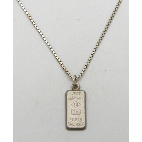 7029 - A silver ingot pendant with Aquarius design, marked West Germany 3g 999.8 fine silver, 2.2cm includi... 