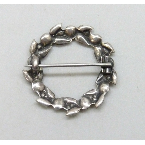 7032 - An early 20th century Arts & Crafts white metal and enamel wreath design brooch, attributred to Bern... 