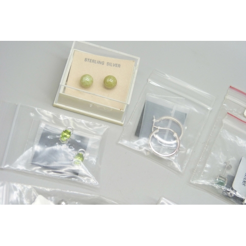 7046 - A collection of silver and white metal earrings