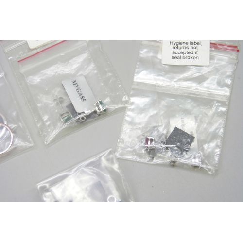 7046 - A collection of silver and white metal earrings