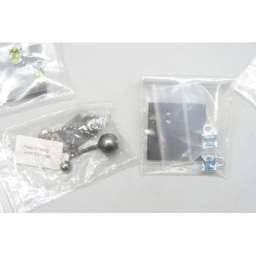 7046 - A collection of silver and white metal earrings