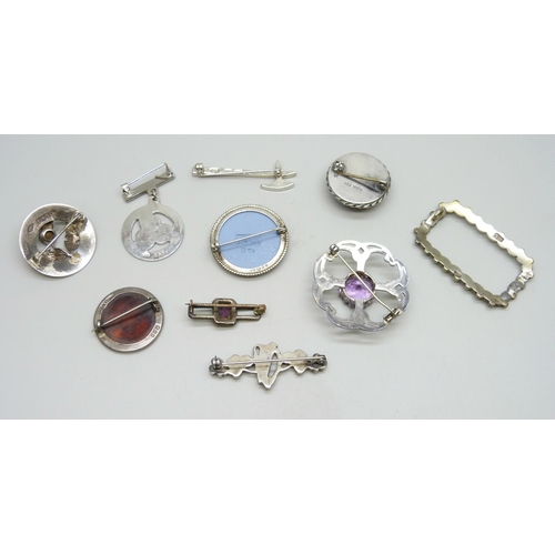 7051 - A collection of silver brooches including .800, some set with amethyst, connemara, etc., 71g total
