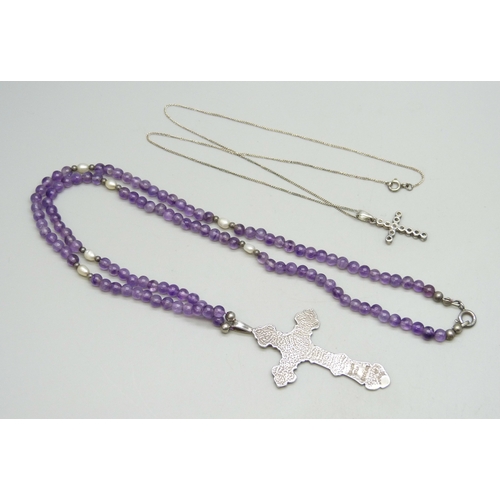 7054 - A silver, amethyst and pearl necklace with a silver cross pendant, and another silver pendant on cha... 
