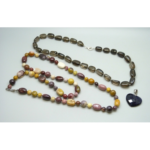 7056 - A Whitney Kelly silver and purple goldstone pendant (a/f chipped), a long Whitney Kelly necklace wit... 
