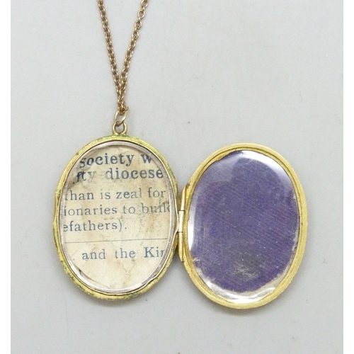 7059 - A 9ct gold locket with engraved design, Birmingham, 1918, 3.5cm including loop, and a 9ct gold chain... 