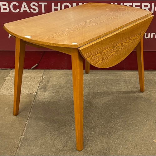 50 - A teak drop-leaf table and four chairs