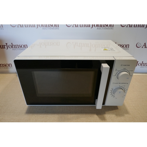 6055 - A Nutmeg microwave with 5 power levels and 30 minute timer *This lot is subject to VAT