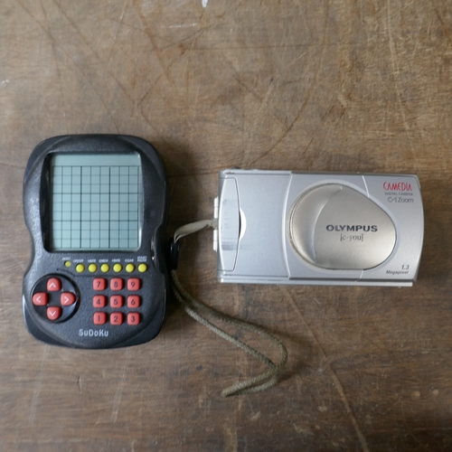 5001 - A quantity of assorted items including portable DVD player, Franklin Spelling Ace, Sudoku player, et... 