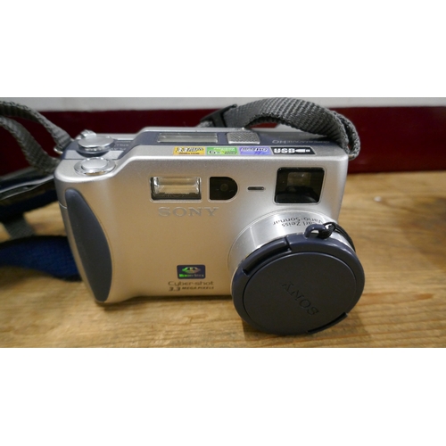 5026 - Three assorted cameras including a Sony Handycam 72x digital zoom camera recorder, a Sony DSC-570 di... 