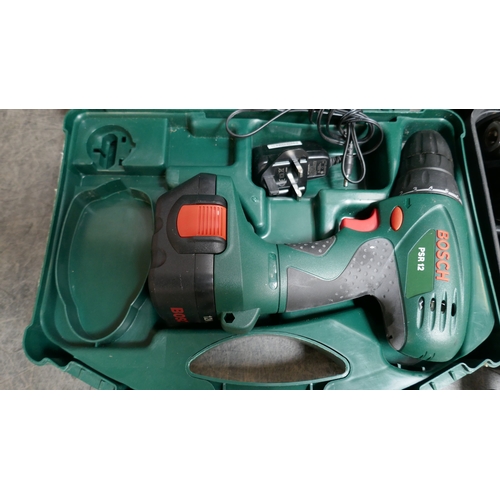 5029 - A Bosch PSR12, 12V battery powered drill and charger and a Parkside DSBM 500, 230V drill
