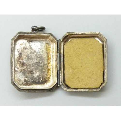 7061 - A Victorian silver bar brooch, 5cm, an early 20th century silver locket, both hallmarked, and a whit... 